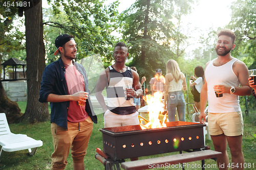 Image of Group of friends making barbecue in the backyard. concept about good and positive mood with friends