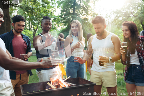 Image of Group of friends making barbecue in the backyard. concept about good and positive mood with friends