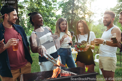 Image of Group of friends making barbecue in the backyard. concept about good and positive mood with friends