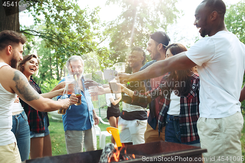 Image of Group of friends making barbecue in the backyard. concept about good and positive mood with friends