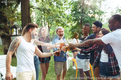 Image of Group of friends making barbecue in the backyard. concept about good and positive mood with friends