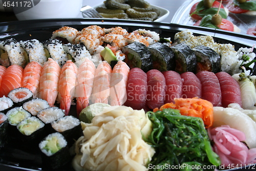 Image of Different kind of sushi as salmon, tuna, rolls and so on