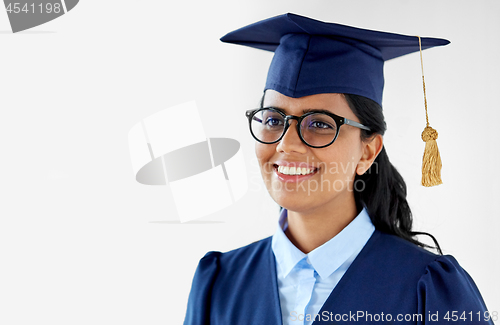 Image of happy female graduate student in mortarboard