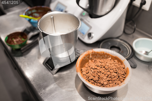 Image of chocolate buttons in bowl at confectionery shop