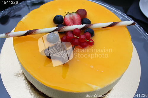 Image of Cake with decoration of chocolate and berries