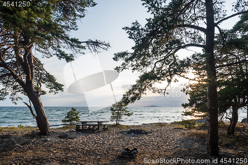 Image of Benches and table in an evening view by the coast of the Baltic 