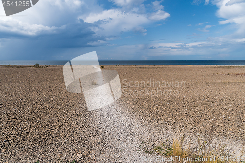 Image of Open landscape with pebbles by the coast