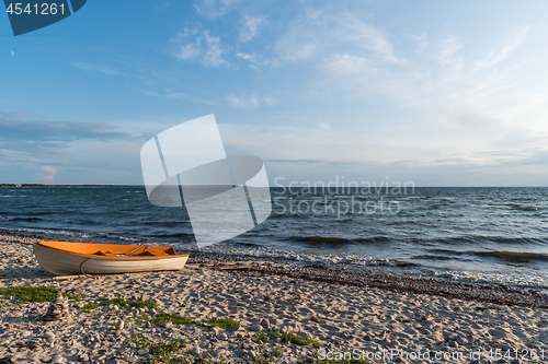 Image of Colorful rowing boat landed on the beach