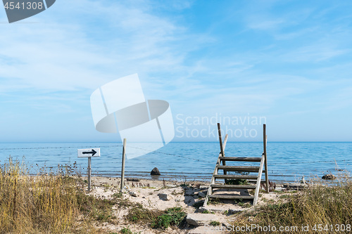 Image of Footpath with a stile across a fence by the sea