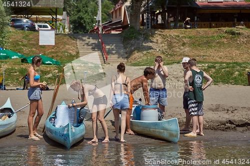 Image of Canoes on the Riverside