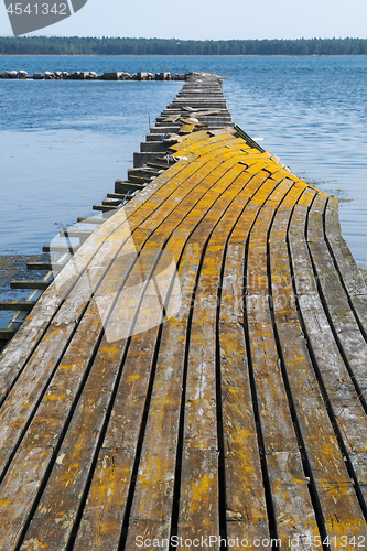 Image of Broken old jetty in yellowish color