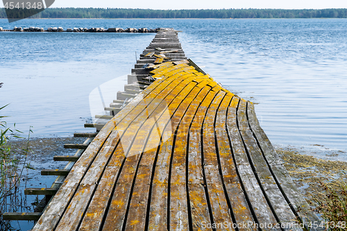 Image of Old damaged pier by seaside