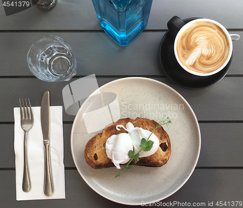 Image of Poached eggs on toast with coffee