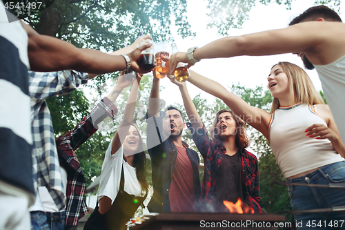 Image of Group of friends making barbecue in the backyard. concept about good and positive mood with friends