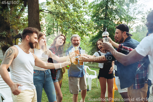 Image of Group of friends making barbecue in the backyard. concept about good and positive mood with friends