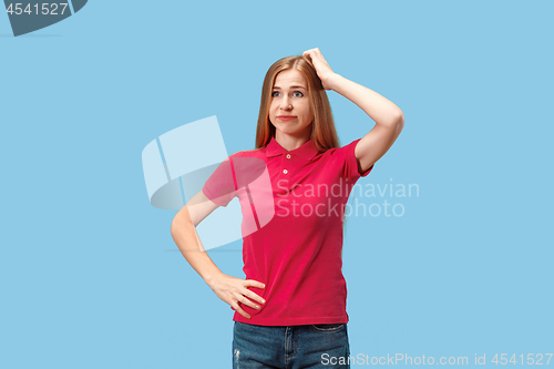 Image of Young serious thoughtful business woman. Doubt concept.