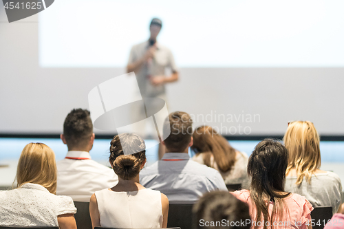 Image of Male business speaker giving a talk at business conference event.