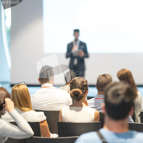 Image of Male business speaker giving a talk at business conference event.