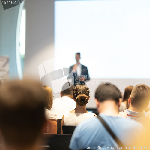 Image of Male business speaker giving a talk at business conference event.