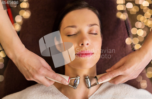 Image of woman having hydradermie facial treatment in spa