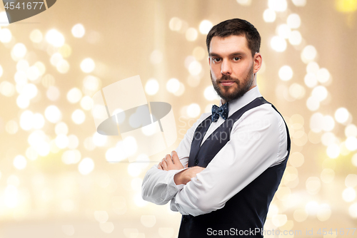 Image of man in party clothes and bowtie