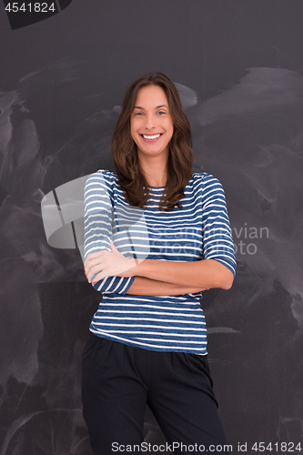 Image of woman standing in front of chalk drawing board