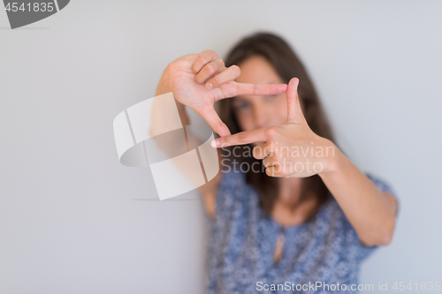 Image of woman showing framing hand gesture