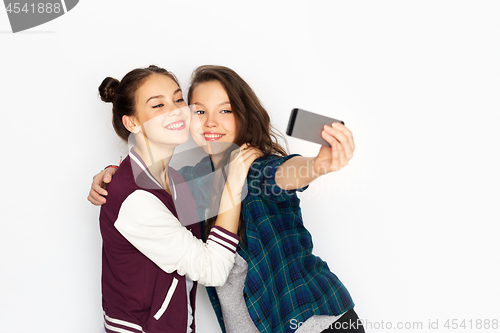 Image of happy teenage girls taking selfie by smartphone