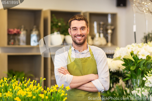 Image of florist man or seller at flower shop counter