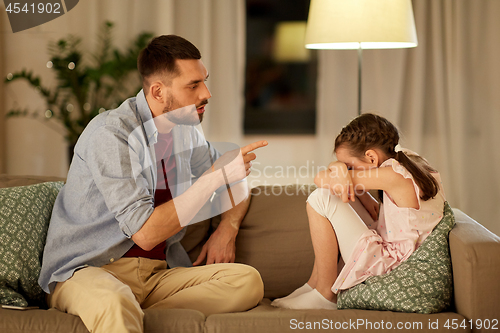 Image of upset or feeling guilty girl and father at home