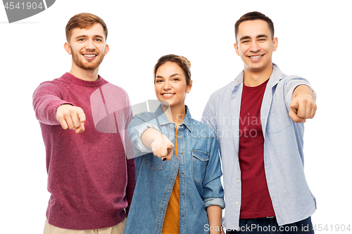 Image of group of smiling friends pointing at you over