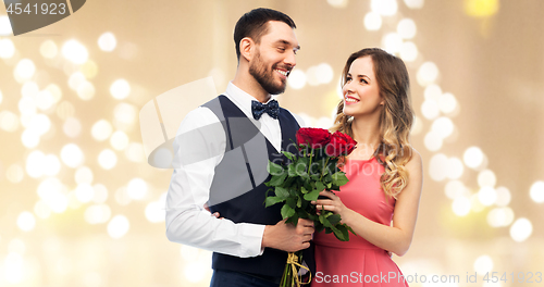 Image of couple with bunch of flowers on valentines day