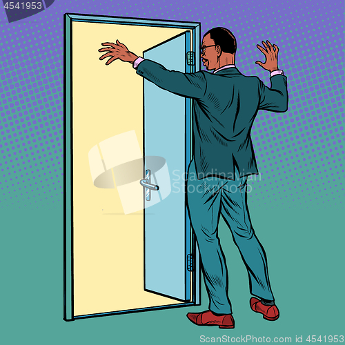 Image of Pop art african man opens the door, greeting