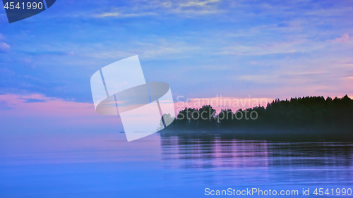 Image of Lilac Seascape With Pink And Blue Clouds After Sunset