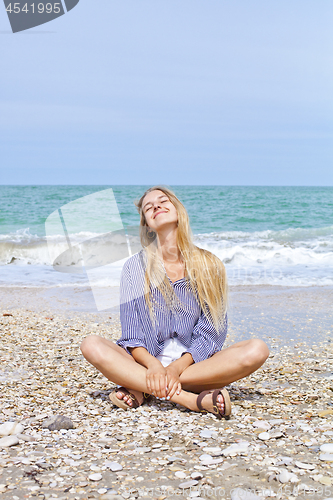 Image of Beautiful happy girl on the Adriatic beach. Travel and vacation.