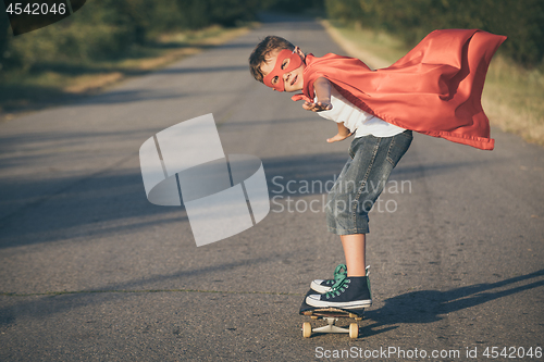 Image of Happy little child playing superhero.