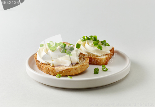 Image of plate of toasted bread with cream cheese