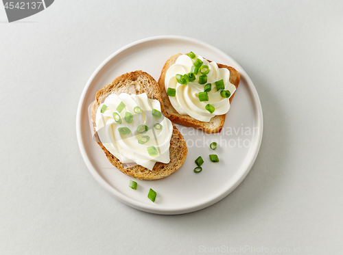 Image of plate of toasted bread with cream cheese