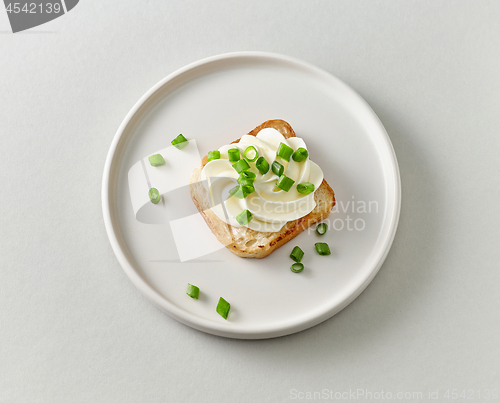 Image of plate of toasted bread with cream cheese