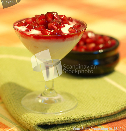 Image of broken ripe pomegranate fruit and seeds