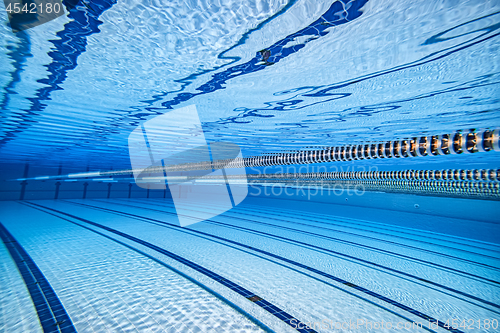 Image of Olympic Swimming pool under water background.