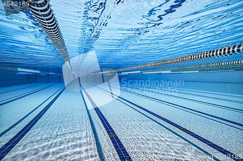 Image of Olympic Swimming pool under water background.