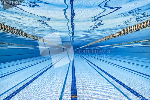 Image of Olympic Swimming pool under water background.