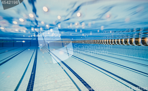 Image of Olympic Swimming pool under water background.