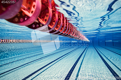 Image of Olympic Swimming pool under water background.