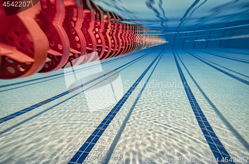 Image of Olympic Swimming pool under water background.