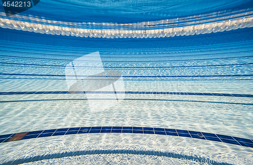 Image of Olympic Swimming pool under water background.