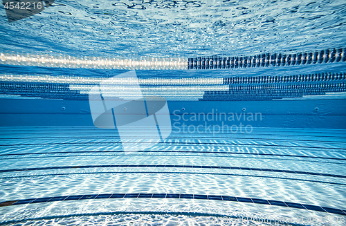 Image of Olympic Swimming pool under water background.