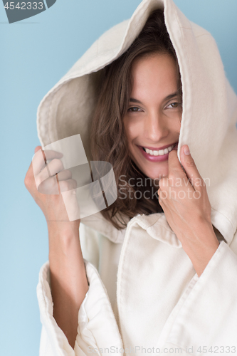 Image of woman in a white coat with hood isolated on blue background