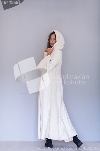 Image of woman in a white coat with hood isolated on white background